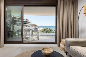 a living room with a view of the ocean at Luxury 3bed-Apartment with Stunning Sea Views in Rincón de la Victoria