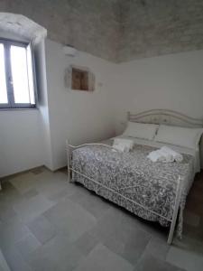 A bed or beds in a room at Trulli Live Alberobello