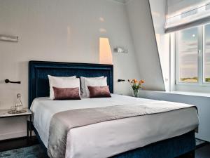 Posteľ alebo postele v izbe v ubytovaní Hotel Indigo Warsaw Nowy Świat by IHG