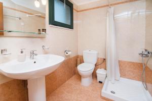 A bathroom at Roubini Apartments