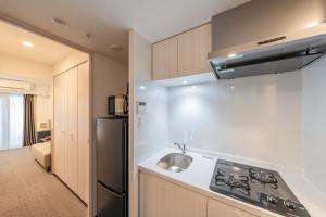Kuchnia lub aneks kuchenny w obiekcie Apartment Hotel 11 Nagoya
