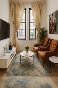 a living room with two couches and a tv at Lekki Luxe 4BR Retreat in Ikota