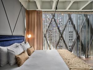 Posteľ alebo postele v izbe v ubytovaní Hotel Indigo Warsaw Nowy Świat by IHG
