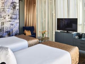 Posteľ alebo postele v izbe v ubytovaní Hotel Indigo Warsaw Nowy Świat by IHG