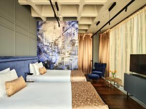 Televízia a/alebo spoločenská miestnosť v ubytovaní Hotel Indigo Warsaw Nowy Świat by IHG