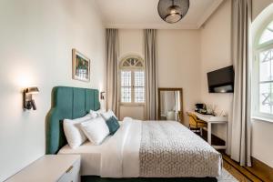 Voodi või voodid majutusasutuse THE GUTMAN TLV - Neve Tzedek toas