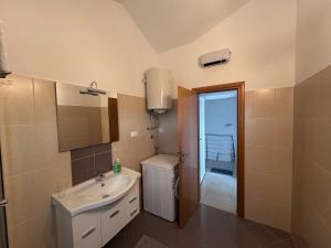 a bathroom with a sink and a mirror at Villa Sbay in Omišalj +65 photos