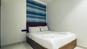 Postel nebo postele na pokoji v ubytování Palm Breeze Hotel - Colaba