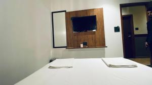 Postel nebo postele na pokoji v ubytování Palm Breeze Hotel - Colaba