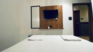 Postel nebo postele na pokoji v ubytování Palm Breeze Hotel - Colaba