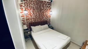 Postel nebo postele na pokoji v ubytování Palm Breeze Hotel - Colaba