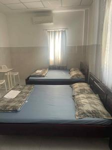 Postel nebo postele na pokoji v ubytování Như Ý