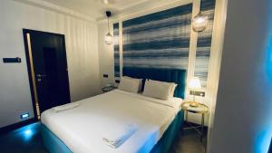 Postel nebo postele na pokoji v ubytování Palm Breeze Hotel - Colaba