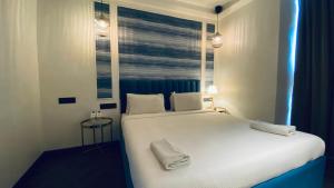 Postel nebo postele na pokoji v ubytování Palm Breeze Hotel - Colaba