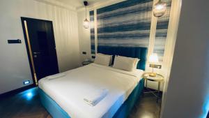 Postel nebo postele na pokoji v ubytování Palm Breeze Hotel - Colaba