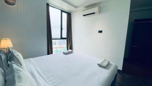 Postel nebo postele na pokoji v ubytování Palm Breeze Hotel - Colaba