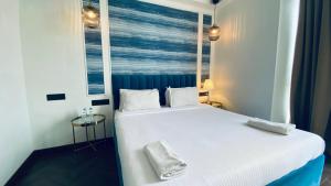 Postel nebo postele na pokoji v ubytování Palm Breeze Hotel - Colaba