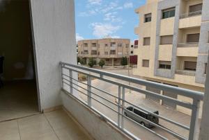 a balcony with a view of a building at Appart Hotel Fes - Joud Families & Travelers in Fès