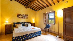 a bedroom with a bed and a window at Il Poderuccio 17, Emma Villas in Cetona +37 photos