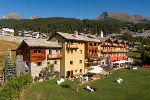 a large building on top of a green field at Hotel La Chance in Pila