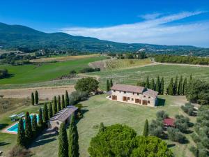 an aerial view of a house on a hill with trees at Il Poderuccio 17, Emma Villas in Cetona