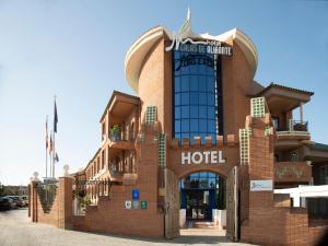 a hotel with a brick building with a hotel at Hotel Boutique Calas de Alicante in Alicante
