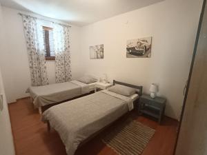 Postel nebo postele na pokoji v ubytování Apartment Greta