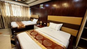 Ліжко або ліжка в номері Chello Suites