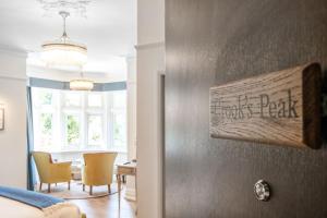 a bedroom with a table and chairs in a room at Sidcot Arms in Winscombe +20 photos