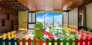 a childrens play area with a playground at Boton Blue Hotel & Spa in Nha Trang