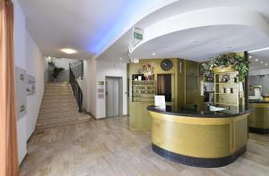 a store lobby with a counter and a staircase at Hotel Fiorita in Bellaria-Igea Marina