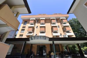 a building with a hotel sign in front of it at Hotel Fiorita in Bellaria-Igea Marina