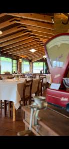 a restaurant with a table and chairs and a restaurant with avertisement at Hotel ristorante San Marco 