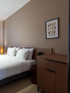 Postel nebo postele na pokoji v ubytování Hotel Admiral Vinkovci