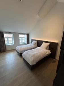 Tempat tidur dalam kamar di Manteka Logies
