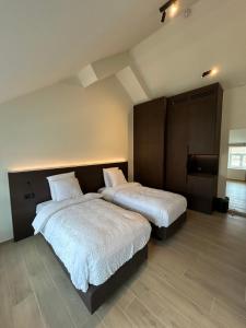 Tempat tidur dalam kamar di Manteka Logies