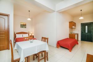 A bed or beds in a room at Roubini Apartments