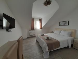 Postel nebo postele na pokoji v ubytování Hotel Dapčević + 37 fotografií