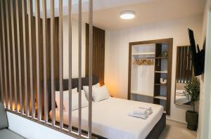 a bedroom with a bed and a mirror at Casa Margarita Parga in Parga