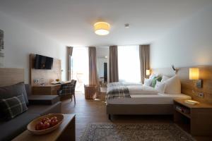Postel nebo postele na pokoji v ubytování Gasthof-Hotel Dannerwirt + 37 fotografií