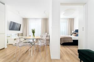 Postel nebo postele na pokoji v ubytování Apartment Opal 21 widok na morze w Balticus Promenada Gwiazd