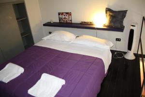 Posteľ alebo postele v izbe v ubytovaní Romeo and Juliet Apartaments