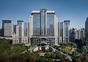 a large building in a city with tall buildings at The Azure Ningbo, Vignette Collection in Ningbo