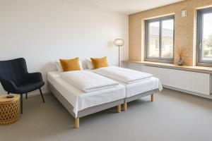 Postel nebo postele na pokoji v ubytování Hotel Svanegården