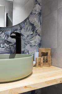 a bathroom with a sink on a wooden counter at Apartamento Río Turia 4 in Valencia