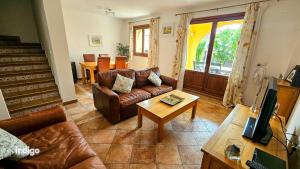 a living room with a couch and a table at SIM01 Direct Access to Pool Area Las Lomas in Ayamonte