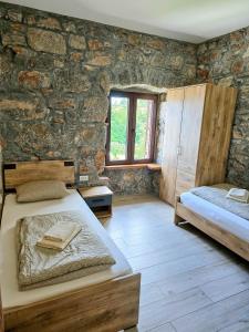 Postel nebo postele na pokoji v ubytování Casa Storia & Casa Antica