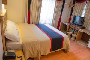 Tempat tidur dalam kamar di Hotel Ganesh Himal