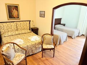 Letto o letti in una camera di Hotel Archimede Ortigia