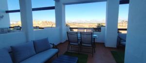 a living room with a couch and a table and chairs at Casa Émir in Roldán